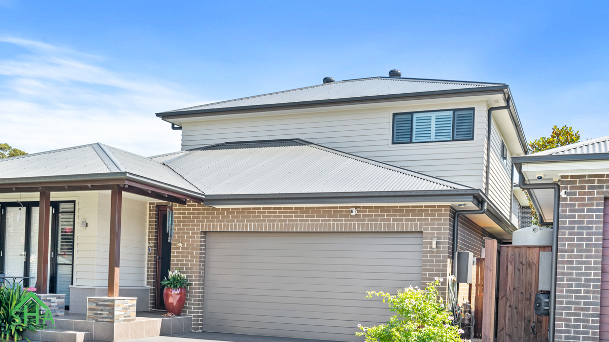 After Second Storey Addition Gledswood Hills Completed second storey addition Gledswood Hills 70m2 built by Smart Home Additions featuring a modern upper level, double garage, plantation shutters and enhanced street appeal