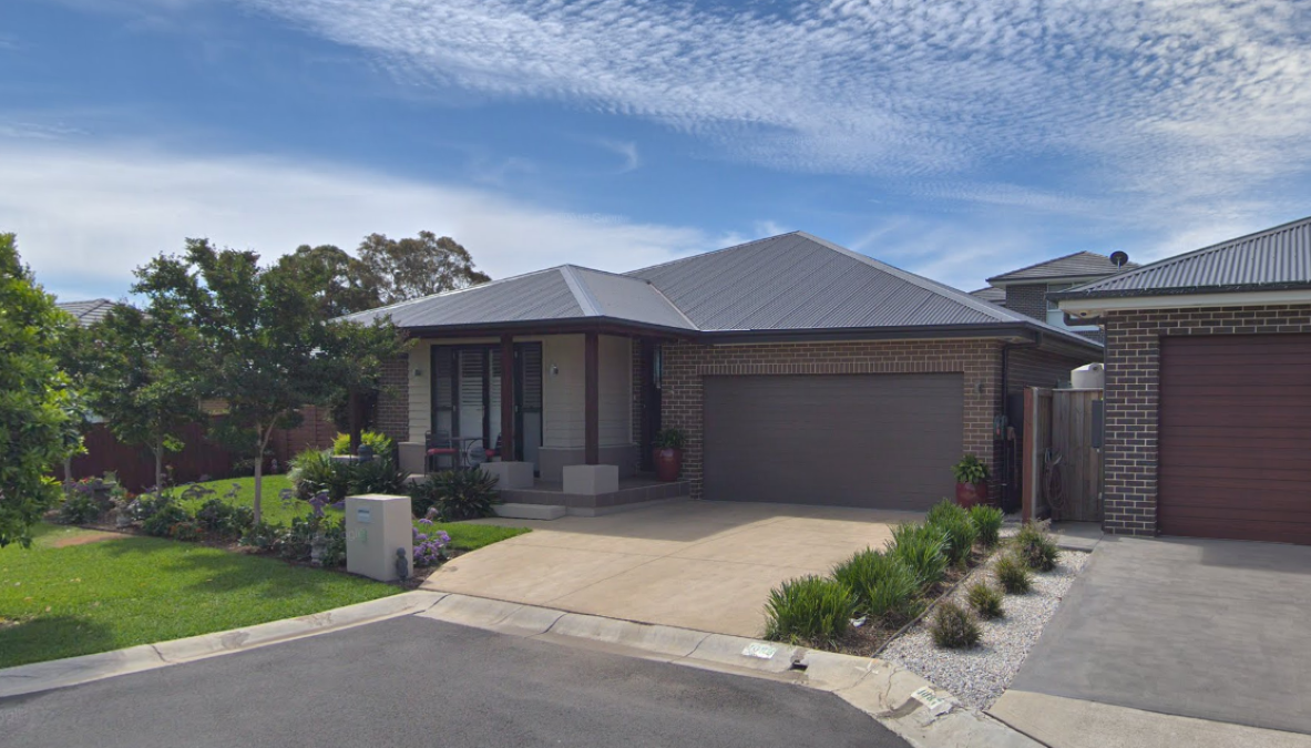 Before Second Storey Addition Gledswood Hills Original single-storey home before second storey addition Gledswood Hills 70m2 built by Smart Home Additions showing existing streetscape and facade