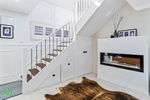 Living room and staircase in a 70m² second storey addition built by Smart Home Additions in Jordan Springs