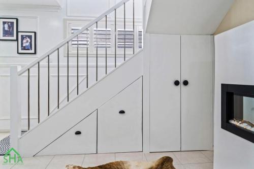 Staircase beneath a 70m² second storey addition built by Smart Home Additions in Jordan Springs