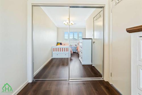 Built-in robe within a 70m² second storey addition built by Smart Home Additions in Jordan Springs