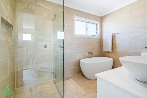 Bathroom with shower and vanity in a 70m² second storey addition by Smart Home Additions in Jordan Springs