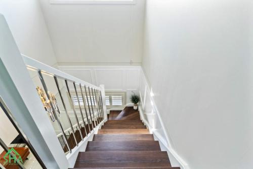 Staircase leading to a 70m² second storey addition built by Smart Home Additions in Jordan Springs
