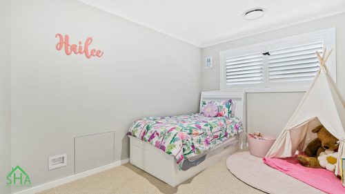 Spacious child's bedroom in second storey addition Gledswood Hills 70m2 built by Smart Home Additions