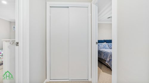 Built-in wardrobe in second storey addition Gledswood Hills 70m2 built by Smart Home Additions