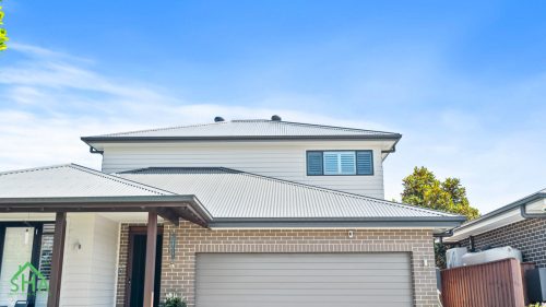 Contemporary home exterior in second storey addition Gledswood Hills 70m2 built by Smart Home Additions