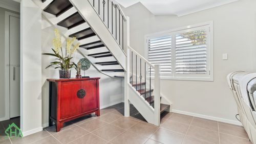 Staircase and entry feature in second storey addition Gledswood Hills 70m2 built by Smart Home Additions