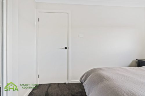 Internal bedroom door in completed 60m² second storey addition in Mount Annan