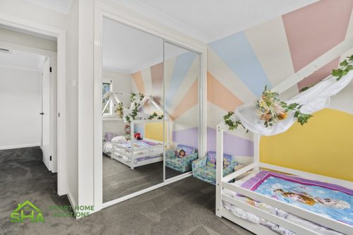 Modern bedroom in 60m² second storey addition in Mount Annan