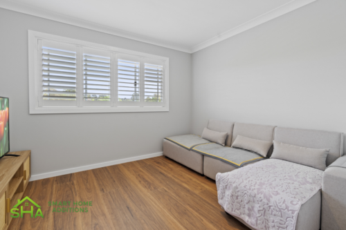 Bright living room in an 80m² second storey addition built by Smart Home Additions in Epping with large windows and modern finishes