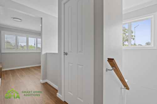 Stair landing within an 80m² second storey addition built by Smart Home Additions in Epping connecting new family living spaces