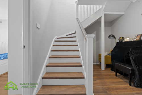 Modern staircase in an 80m² second storey addition built by Smart Home Additions in Epping designed for seamless access between levels